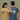 Two people wearing t-shirts with 'Gaylord Michigan' design on a plain background