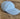 Light blue baseball cap on a textured brown surface